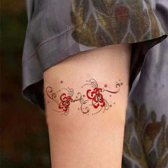 Small Red Spider Lily and Star Tattoo