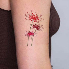 Small Watercolor Spider Lily Flower Tattoo