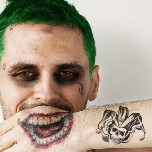 joker hand tattoo